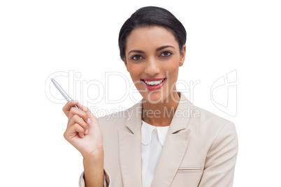 Confident businesswoman holding a pen