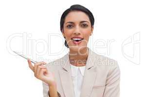 Smiling businesswoman holding a pen