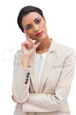 Cheerful pensive businesswoman standing