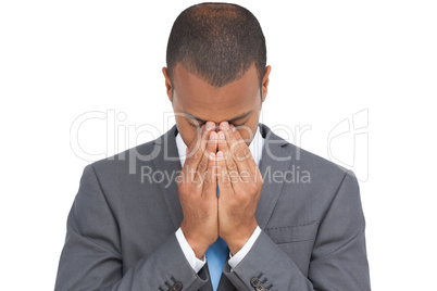 Businessman holding his head between hands