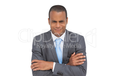 Doubtful businessman with arms crossed