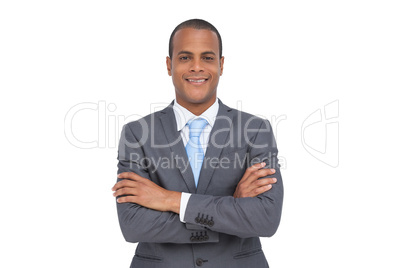 Charismatic young businessman with arms crossed