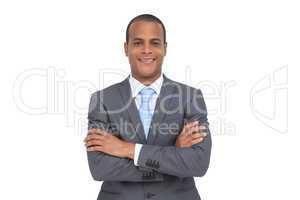 Charismatic young businessman with arms crossed