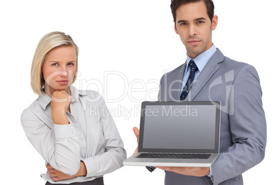 Business people presenting a laptop