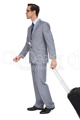 Businessman walking with suitcase