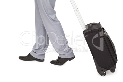 Businessman legs walking with a suitcase