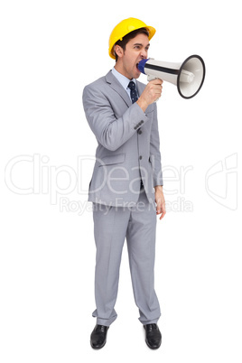 Young architect yelling with a megaphone