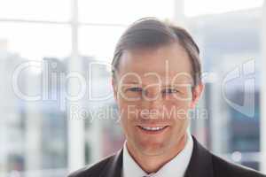 Close up of confident businessman standing