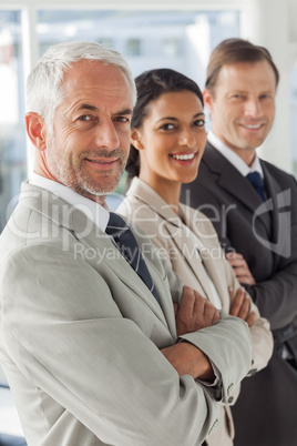 Cheerful business people looking in the same way