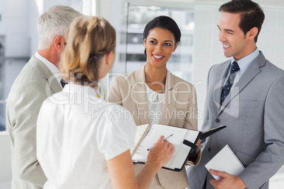 Smiling business people making an appointment