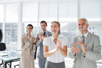 Group of business people applauding