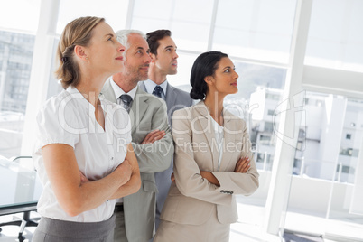 Confident business people looking at the same way