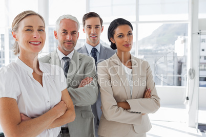 Smiling business people standing together