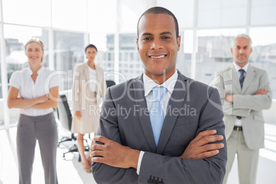 Smiling businessman with arms crossed