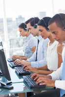 Call center employees sitting in line