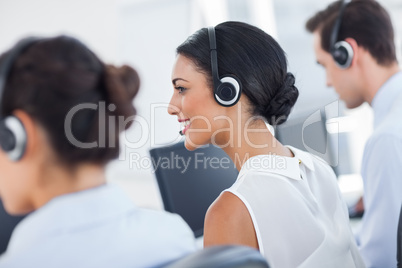 Three call centre employees working