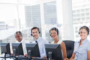 Line of call centre employees smiling