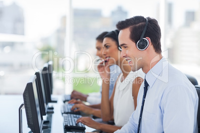 Smiling agent working in a call centre