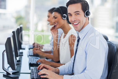 Joyful agent working in a call centre