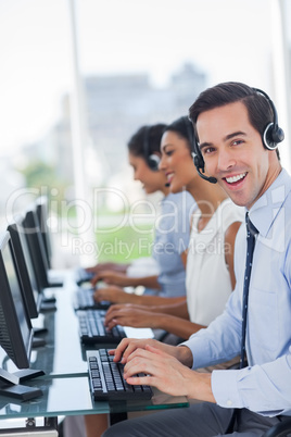 Joyful call centre agent working