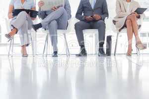 Group of well dressed business people waiting