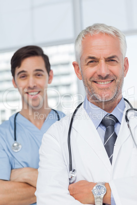 Smiling doctors with arms crossed