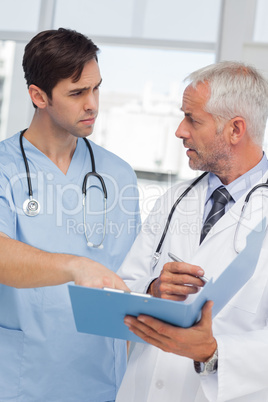 Serious doctors talking about file