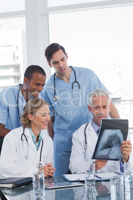 Medical team examining radiography