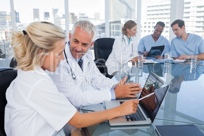 Two doctors with a laptop