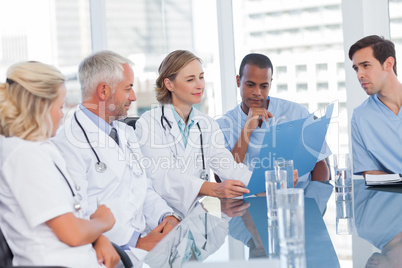 Medical team looking at a file