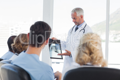 Doctor explaining x-ray to his team