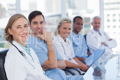 Medical team sitting in row