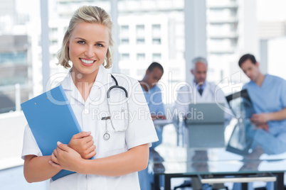 Young nurse holding file