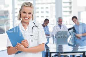 Young nurse holding file