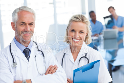 Doctors holding blue file