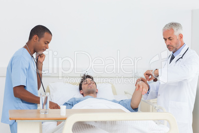 Doctors examining a patient