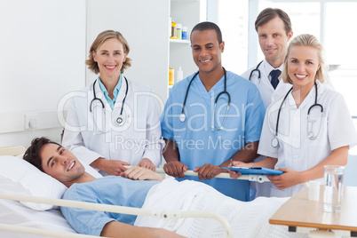 Medical team and patient smiling