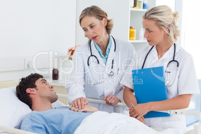 Doctors talking to a patient
