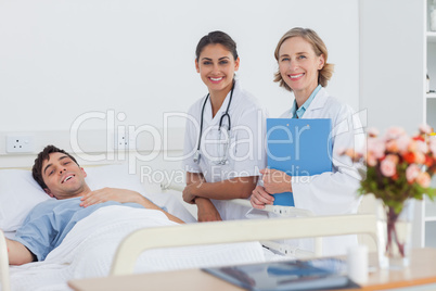 Patient and doctors looking at the camera