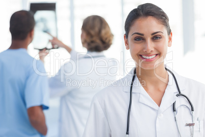 Young woman doctor looking at the camera