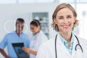 Woman doctor smiling and looking to the camera