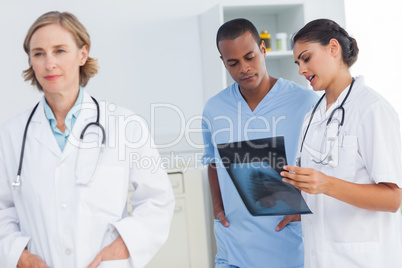 Doctor standing in front of medical team