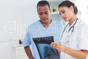 Two doctors examining an x-ray