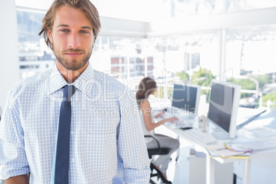 Portrait of smiling man in creative office