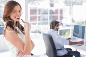 Portrait of smiling woman in creative office