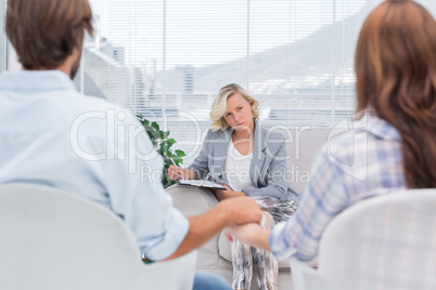 Therapist listening to couple during a session