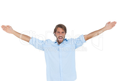 Handsome man shouting with his hands raised