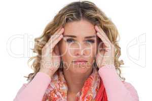 Blonde woman suffering with headache