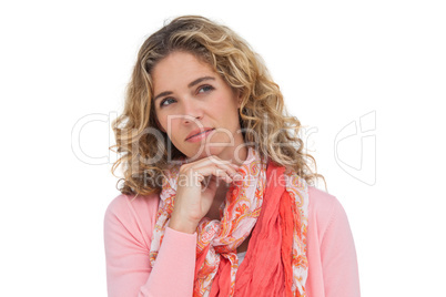 Thoughtful attractive woman standing alone