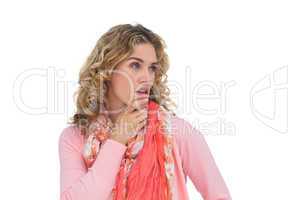 Blonde thoughtful woman posing while touching her chin